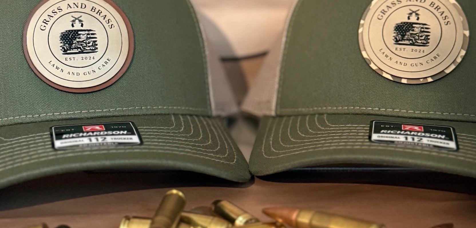 Two green caps with custom branding